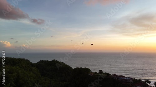 Aerial drone shot of the famous Obelix Sea View viewpoint during a vibrant sunset at the southern coast of Java.
