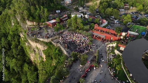 Aerial drone shot of the famous Obelix Sea View viewpoint during a vibrant sunset at the southern coast of Java.