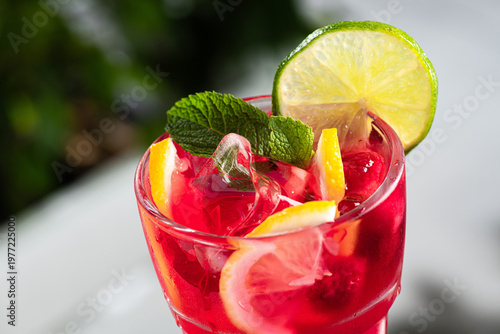 Refreshing red berry lemonade with ice cubes