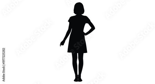 A solitary woman standing with hand on hip a striking silhouette