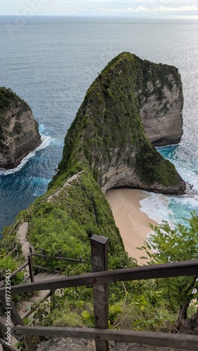 Exploration of Kelingking Beach in Bali Indonesia, tropical paradise with turquoise ocean and majestic cliffs, iconic viewpoint and trail descending to shoreline, scenic hike with panoramic vista