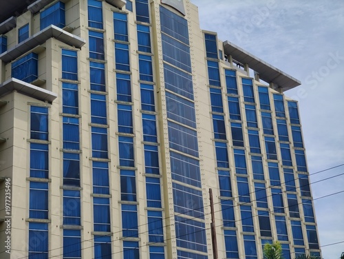 a magnificent and luxurious hotel building with blue glass