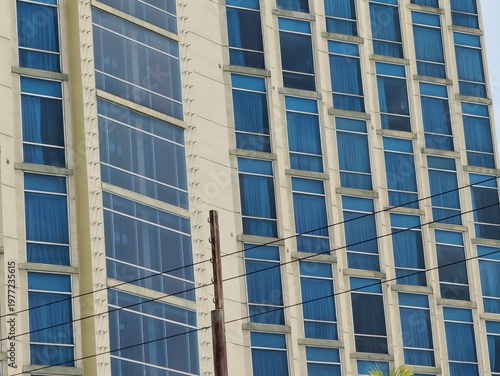 a magnificent and luxurious hotel building with blue glass