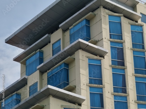 a magnificent and luxurious hotel building with blue glass