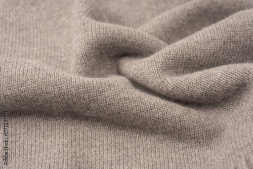 Soft grey merino wool sweater texture as a background.