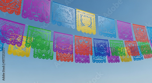 Colorful prayer flags hanging freely outdoors.