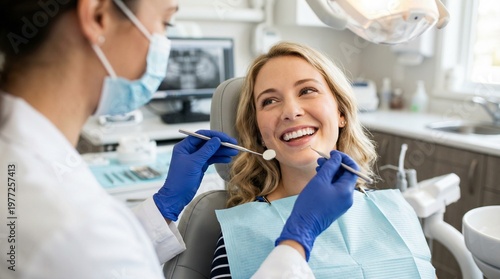 Professional dentist examining female patient teeth with mirror and probe in clinic. Modern dental checkup and healthcare service. Smiling woman in dentist chair.