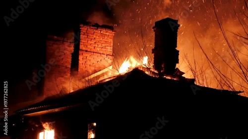 The house is on fire. A scary video of a burning dwelling.