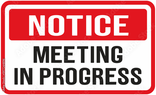 door sign that says : notice meeting in progress
