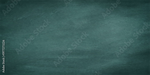 A dark green grunge chalkboard texture with a blank aged paper design and a rough vintage wall backdrop for an empty textured material background
