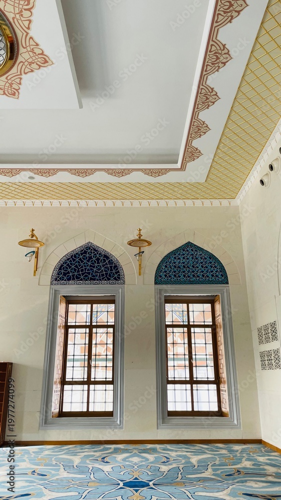 Obraz premium Traditional Ottoman style mosque interior with decorative ceiling and windows