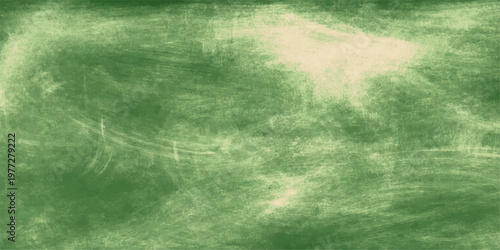 A vintage grunge nature backdrop featuring green grass under a dark storm sky with moody clouds and a faded paper texture design