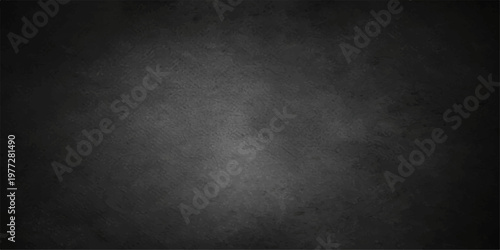 A dark and moody black grunge wall background featuring a weathered concrete texture with an old vintage paper pattern and a rough scratched surface for a blank industrial design backdrop