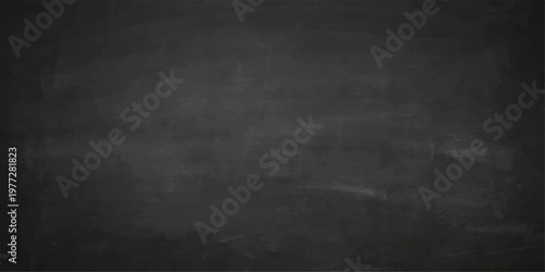 A blank vintage blackboard with chalk on a dark grunge textured surface creates an old grey concrete wall backdrop for a dirty chalkboard design