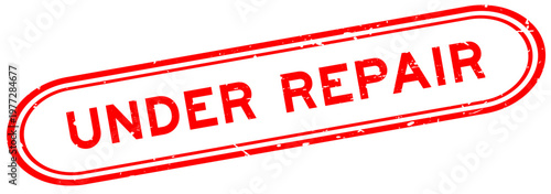 Grunge red under repair word rubber seal stamp on white background