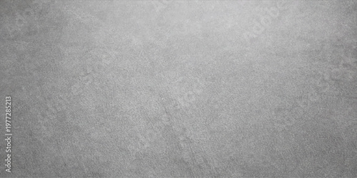 Brushed metal texture background features a gray textured surface with a light grunge pattern on a blank vintage material backdrop