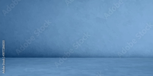 Empty room featuring a vintage grunge blue wall and rough gray concrete floor with a dark textured stone surface for an interior backdrop