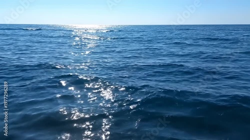 Horizon view of the blue ocean under a clear, cloudless sky