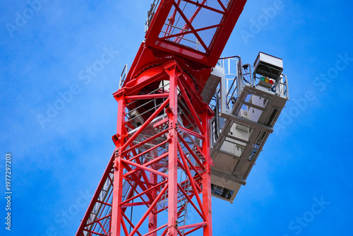 Картината върху платно Tower crane upper deck above the building construction site.