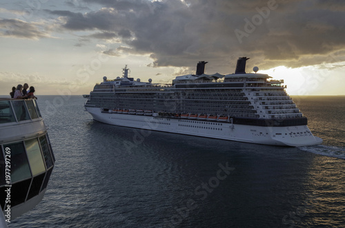 Modern family cruiseship cruise ship liner Equinox departs from Key West, Florida for Caribbean cruising sail away twilight sunset harbor view