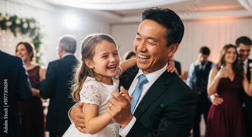 Happy father dancing with daughter at wedding reception indoors  