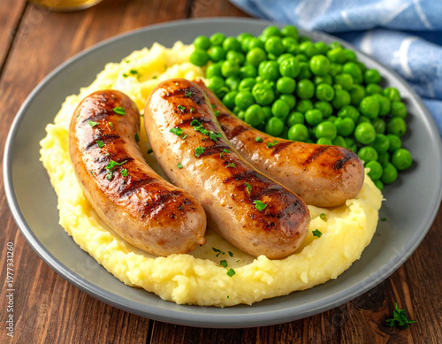 A plate of food featuring three grilled sausages placed on a bed of creamy mashed potatoes with a side of peas. Ai