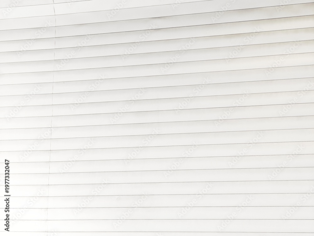 Obraz premium Closeup of clean white horizontal window blind slats arranged in evenly spaced parallel rows, creating a simple bright minimalist striped pattern with subtle shadows.