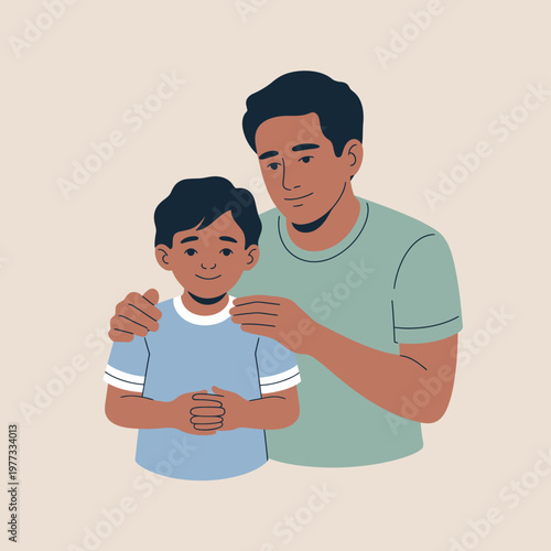A father lovingly stands behind his son, resting his hands on the child's shoulders.