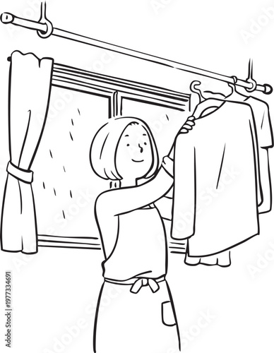 雨の日に室内干しをするお母さん_線画