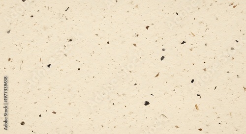Textured recycled paper background with natural fibers and flecks for crafts and design projects