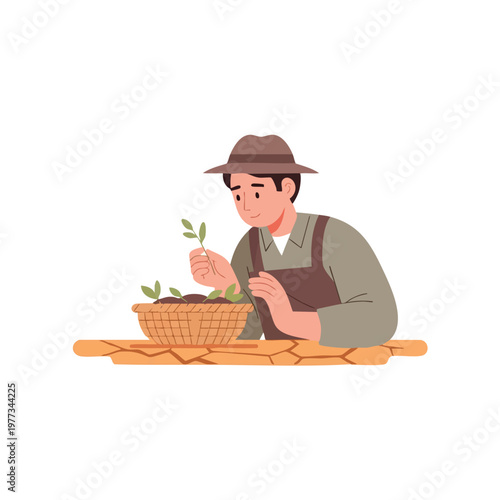 Farmer examining young plant sprouts in a basket.