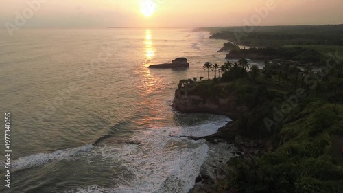 Beautiful sunset at tropical beach Karang Gantungan, Sukabumi, Indonesia.
