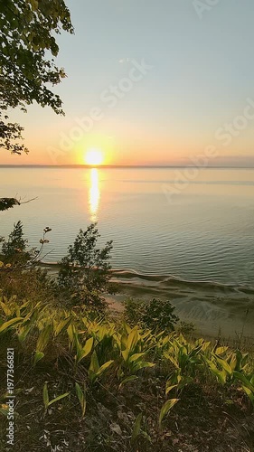 Beautiful sunset on a high river bank. Spring landscape.