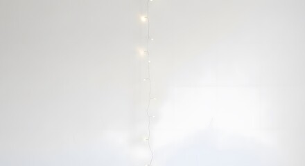 Elegant Vertical Fairy Lights on Soft White Background