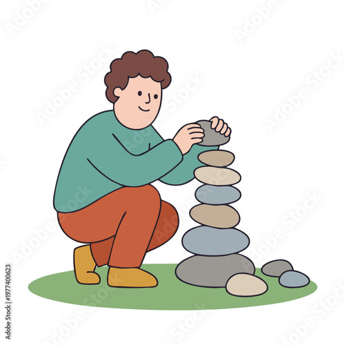 Person carefully stacking stones to build a tower.