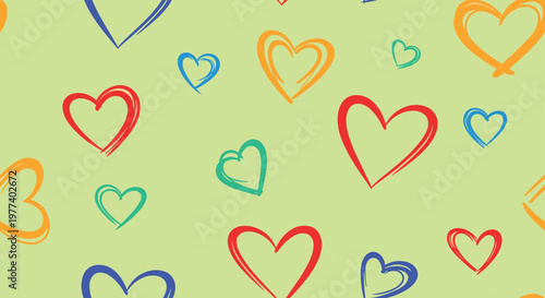 Seamless pattern of hand drawn colorful heart outlines on a light green background represents love and happiness.