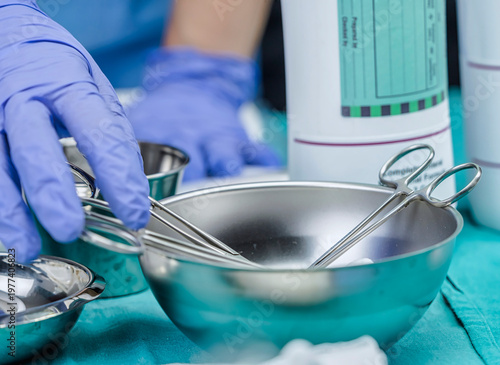 Some scissors for surgery on a tray in an operating theater, conceptual image, horizontal composition