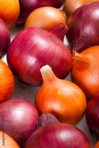 onions on white wood tray, wooden table background