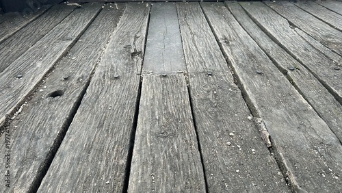 Grey old wood texture made of natural ancient boards, floor surface. Perspective view.