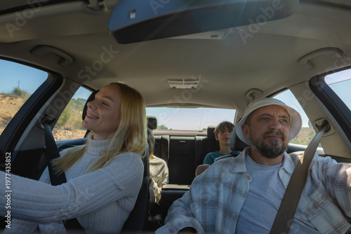 Photos Family driving car during road trip, enjoying vacation together on sunny day, sm