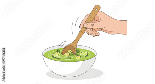 hand mixing green soup with wooden spoon in white bowl