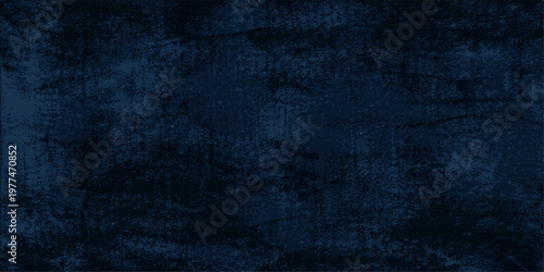 A dark blue grunge abstract background featuring a vintage textured pattern on an old weathered canvas material with a blank closeup design