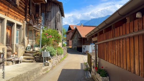 Beautiful Swiss village landscape with colorful houses and mountains, representing peaceful rural environment