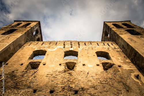 Ancient Castle Wall with Medieval Architecture and Stone Arches