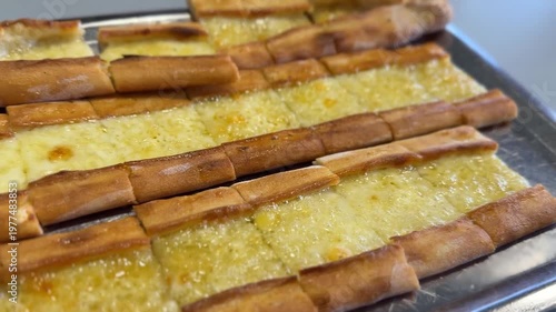Turkish pide with cheese on metal tray, perfect as food background or culinary concept
