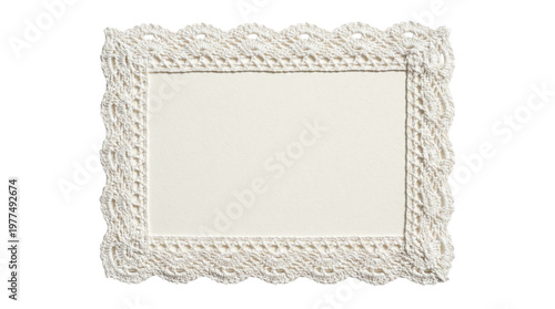 фотографія Blank rectangular paper card decorated with white crocheted lace border on a tra