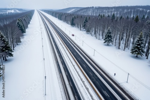 A massive, unbroken field of pristine white snow completely erasing the asphalt of what was once a bustling four lane highway.