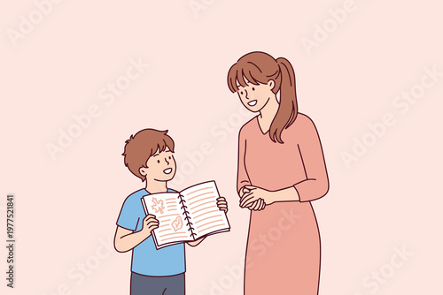 A young boy showing his nature research and school homework to his supportive, happy mother. Concept of family education, home learning, and studying biological sciences.