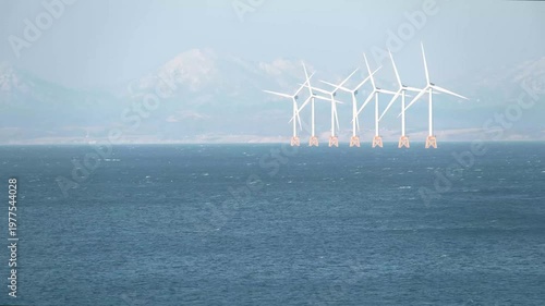 石狩湾に浮かぶ洋上風力発電の風車群 Offshore wind turbines in Ishikari Bay