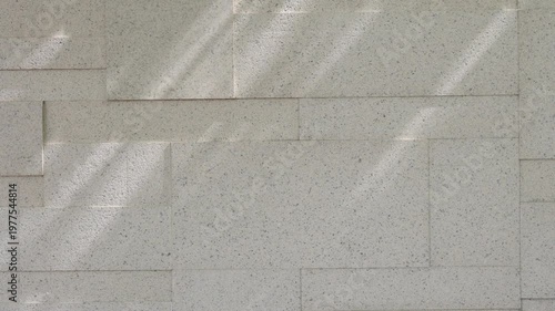 Concrete wall texture with sunlight shadow minimal background